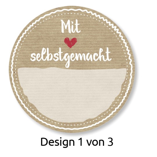Изображение показывает круглую этикетку с текстом «Mit ❤️ selbstgemacht» (С любовью, сделано вручную) и пустым пространством под ним. Дизайн находится на текстурированном, бежевом фоне с декоративными рамками. Также имеется примечание «Design 1 von 3» (Дизайн 1 из 3).